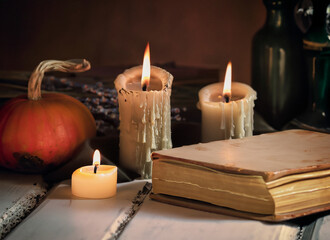 still life with candles and book 