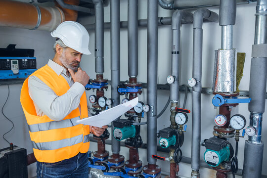 man engineer practicing maintenance Taking care of old machines in the factory