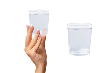A hand holds a glass of water. on isolated transparent background