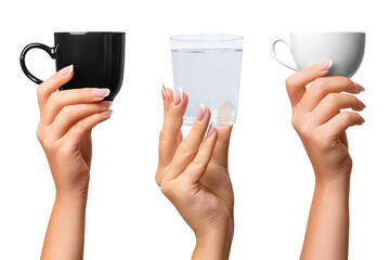 A woman's hand holds a black and white cup and a glass of water. Two options. on isolated...