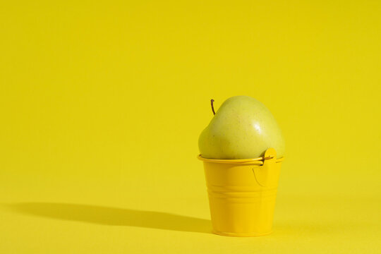 apple  on a bright yellow background