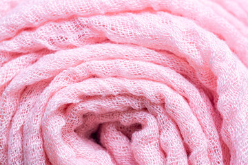 pink cloth roll,Macro close range,Pile of folded pink blankets. Rolls of pink plaids lie on a shelf, texture effect.