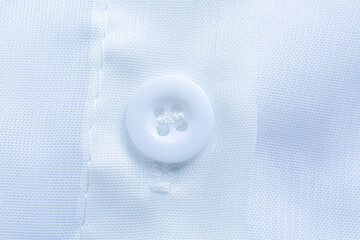Close-up of white shirt buttons,Close-up of a white dress