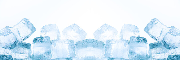 Obraz premium ice cubes isolated white background,Realistic frozen ice cubes and water wave splashes, kitchen skinali panel background. Ice cubes whirl in liquid blue clear aqua wave, 