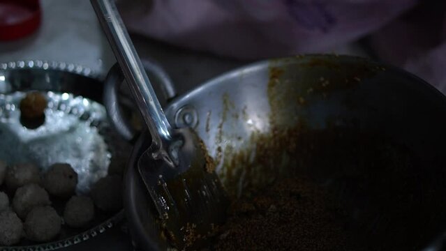 cooking video of making grated coconut balls sweet confectionary at home
