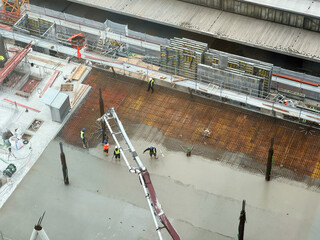 building  a floor by pumping liquid concrete for Concreting on a construction site