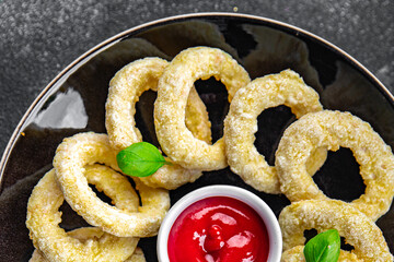 onion rings  fast food deep fryer batter tomato sauceeating cooking appetizer meal food snack on the table copy space food background rustic top view