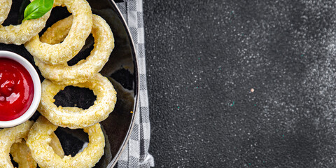 onion rings  fast food deep fryer batter tomato sauceeating cooking appetizer meal food snack on the table copy space food background rustic top view