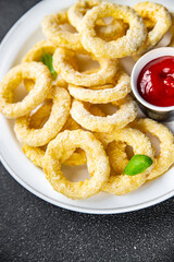 onion rings  fast food deep fryer batter tomato sauceeating cooking appetizer meal food snack on the table copy space food background rustic top view