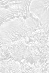 Defocus blurred transparent white colored clear calm water surface texture with splashes reflection. Trendy abstract nature background. Water waves in sunlight with copy space. Blue watercolor shine.