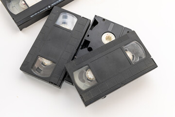Old video cassette tapes isolated in white.
