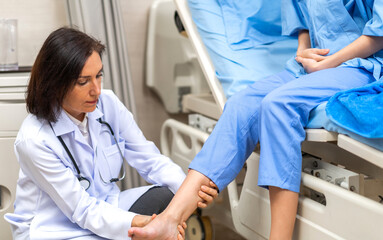 Fototapeta premium Portrait of smiling caring senior doctor trainer carer helping physical discussing and consulting taking care with sick woman patien doing exercises at hospital.care and insurance concept