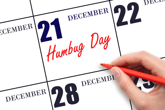 December 21. Hand writing text Humbug Day on calendar date. Save the date.