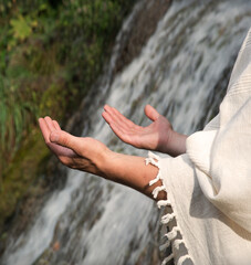 Man praying at the river