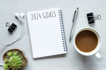 Notebook with 2024 goals text on it to apply new year resolutions and plan.