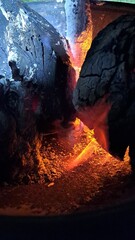 Glowing fire caves made from charcoal briquettes for a braai or barbecue 
