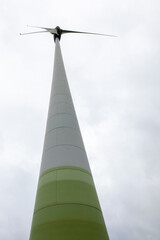Sustainable energy concept. Close up of Wind turbine producing alternative energy