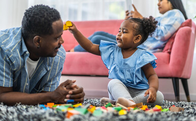 Portrait of enjoy happy love black family, play, having fun, daughter, parenthood, care, african american father and mother with little african girl child smiling moments good time at home - Powered by Adobe