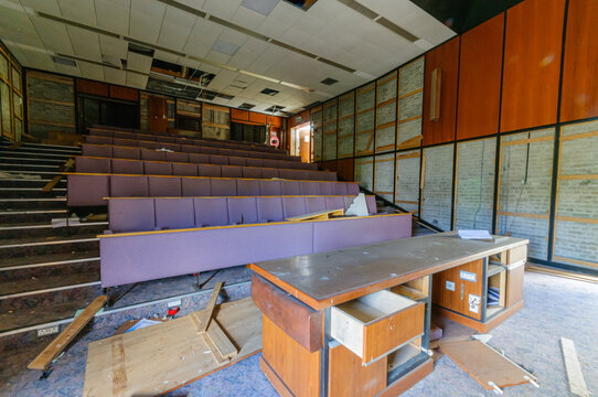 Derelict abandoned lecture theatre in an old college university training department.