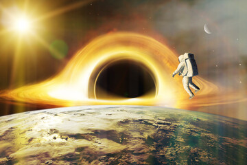 Realistic science fiction art. Spaceman looks at black hole on low-orbit of Earth planet.  Elements...