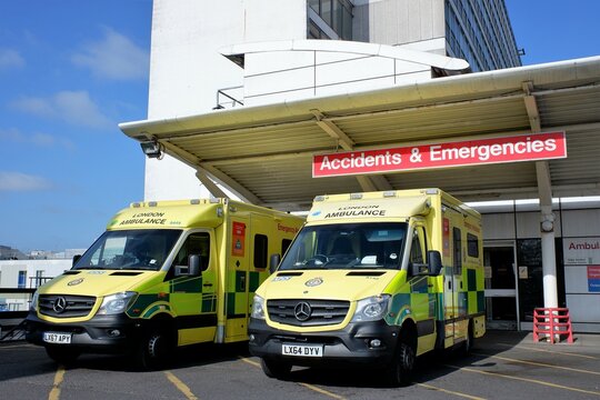 Ambulances outside Accidents and Emergencies entrance at Hillingdon Hospital, Uxbridge