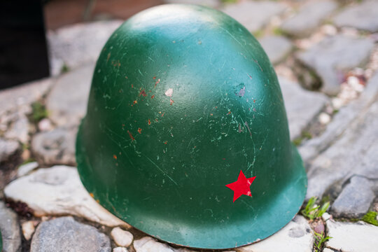 Old military helmet soviet army with a red star. A Soviet military helmet