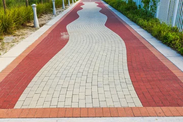 Papier Peint photo Atlantic Ocean Road View of texture paving stones of red path called Walking Street,  in Miami Beach. USA.