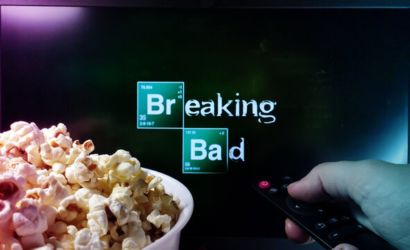 Kyiv. Ukraine. 10.11.2023: Person watching Breaking Bad series with popcorn and remote control. Stock editorial photo.
