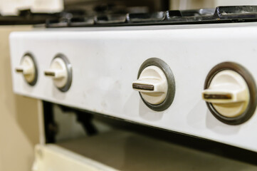 Knobs on a gas hob and oven.