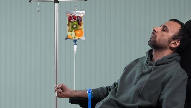  IV Drip Vitamin Infusion Therapy Saline Bag, A young man who is refreshed by IV or Ozone therapy