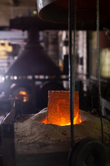 Ferrous metal billet is melted in an induction furnace closeup