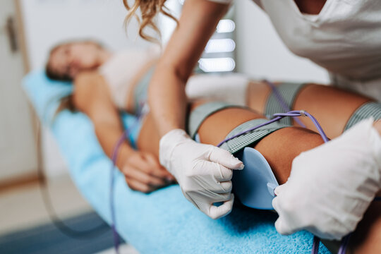 Modern technology medical health and beauty treatment with electrostimulation EMS slimming machine.