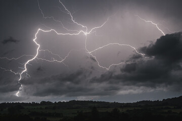 Lightning bolt on the dark cloudy sky
