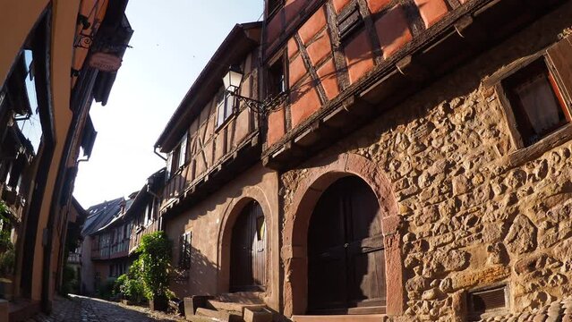 Moving through the colorful half timbered building in the streets of the beautiful Alsace village Riquewihr