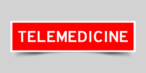 Red color square shape sticker label with word telemedicine on gray background