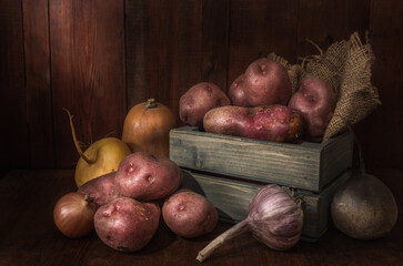 Root vegetables on a dark wooden