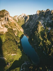 Vertical shot of a beautiful mountains landscape with a small lake in the middle