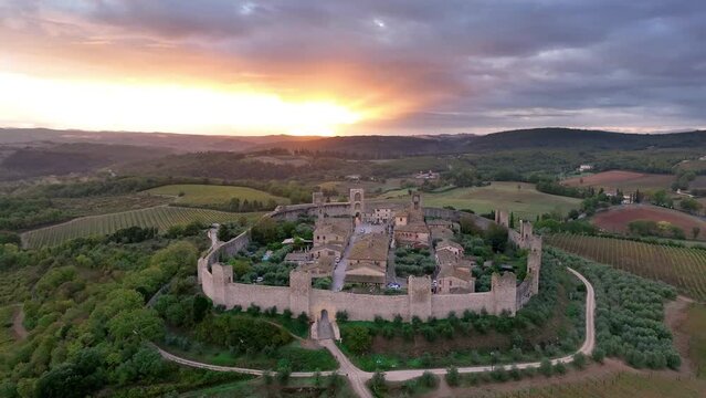 Aerial view of Tuscan landscape with ancient walled city Monteriggioni, Italy. Tuscany medieval town on the hill.