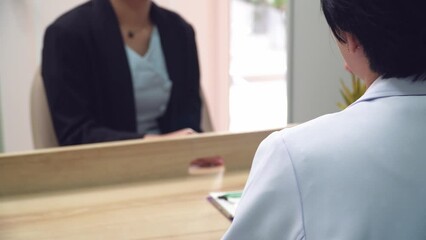 psychiatrist engages in a one-on-one therapy session with a client, offering professional guidance and emotional support in a calm, confidential setting.