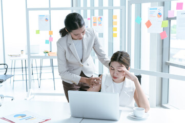 Senior manager helps her colleague who has depressed or unwell in working at the office.