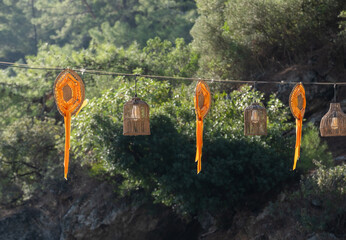 bamboo lanterns and traditional ornaments hanging on rope