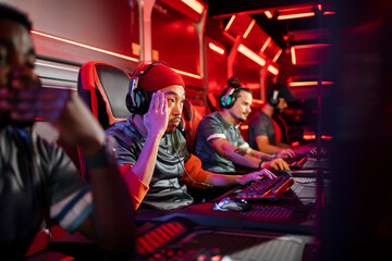 Focused Esports Team Engaged in an Intense Gaming Tournament