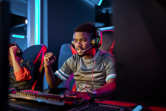 Determined African American Gamer Focused in Esports Competition
