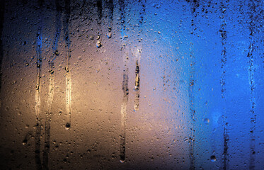 Background of misted glass. Christmas lights