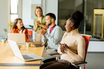 Young multiethnic startup team working in the modern office
