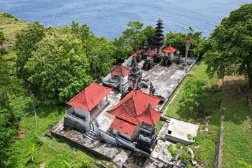 Fotobehang Drone view of hindu Suwehan Temple on sunny day. Tanglad village, Nusa Penida Island, Indonesia. © Kirill