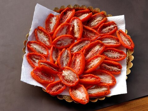 sliced red tomatoes for drying in hot sun shane