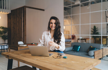 Female blogger sitting at table