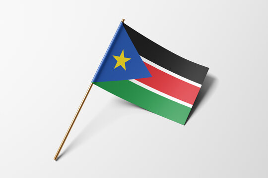 South Sudan flag of small paper, isolated on white background