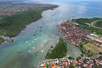 Aerial view of Serangan district and Roadstead in Keramba Wayan Apel Strait on sunny day. Denpasar,...